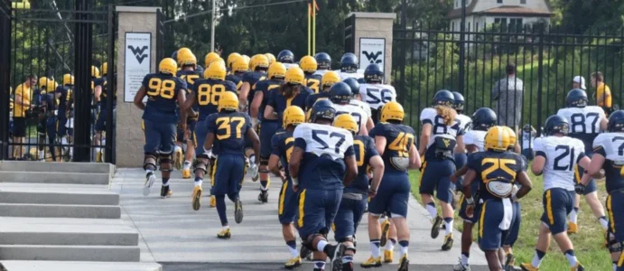 wvu players going up onto practice field